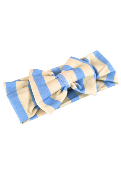 Our Coastal Stripes headband bow features soft blue and cream vertical stripes.