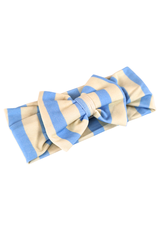 Our Coastal Stripes headband bow features soft blue and cream vertical stripes.
