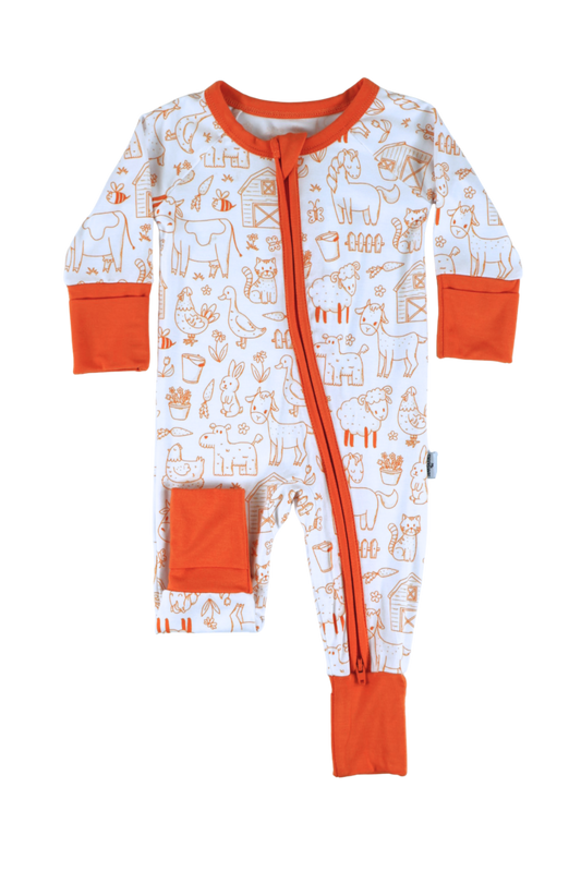 Our one-piece Barnyard Buddies zipper jammies are a charming farm-inspired design featuring a variety of animals including cows, chickens, horses, dogs, cats and more across a white background with matching orange cuffs and trim.
