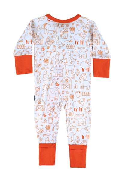 Our one-piece Barnyard Buddies zipper jammies are a charming farm-inspired design featuring a variety of animals including cows, chickens, horses, dogs, cats and more across a white background with matching orange cuffs and trim.