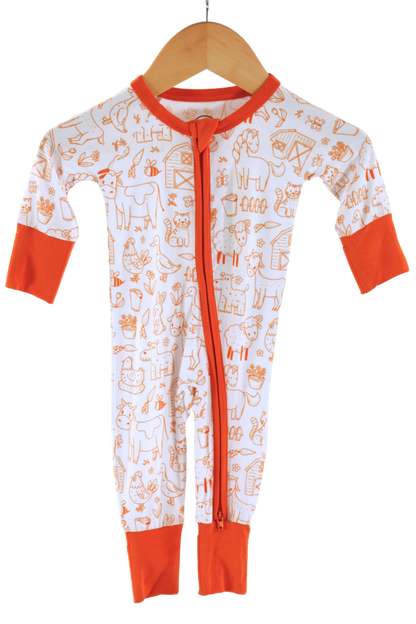 Our one-piece Barnyard Buddies zipper jammies are a charming farm-inspired design featuring a variety of animals including cows, chickens, horses, dogs, cats and more across a white background with matching orange cuffs and trim.